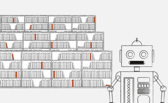 A robot in front of book shelves